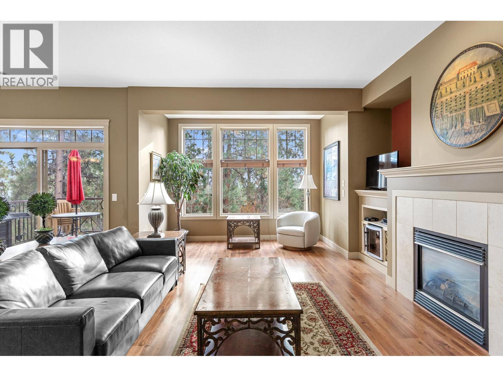 1795 Country Club Drive Unit# 201, Kelowna, BC - Indoor Photo Showing Living Room With Fireplace