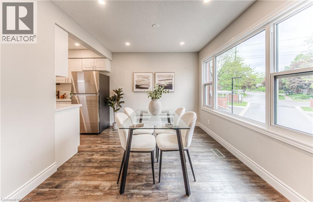 Dining space featuring recessed lighting, dark wood-style floors, and baseboards - 425 Keats Way Unit# 4, Waterloo, ON - Indoor