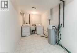 Washroom featuring washer and dryer -