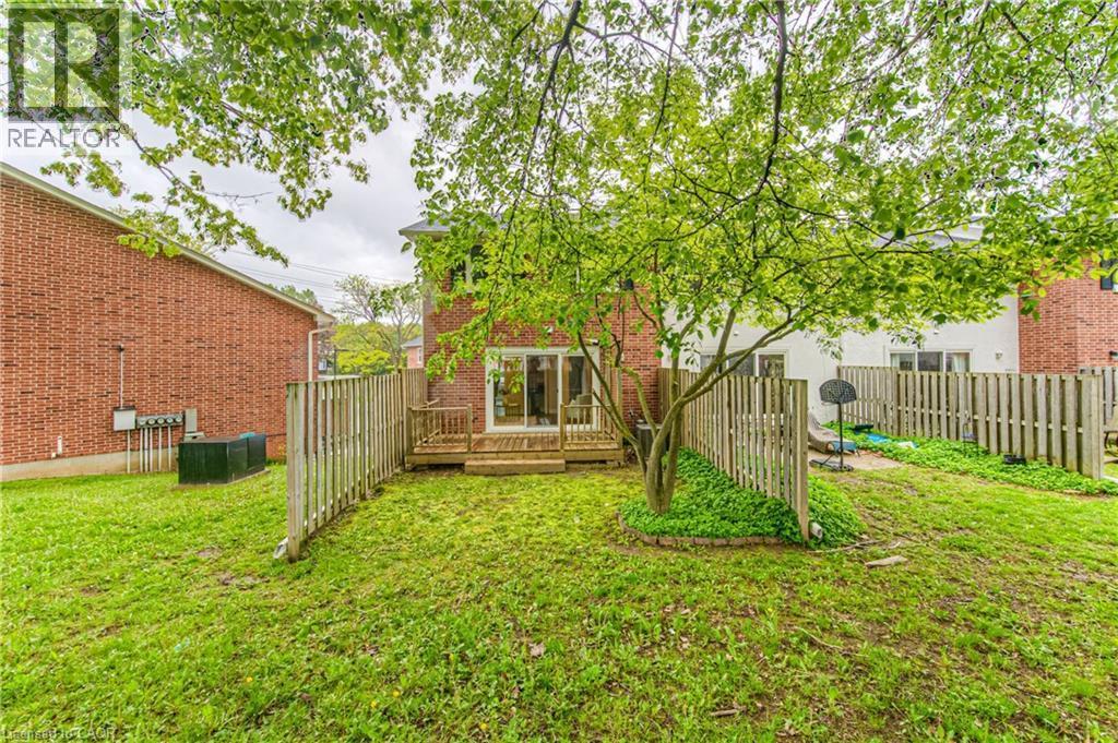View of yard with a wooden deck - 425 Keats Way Unit# 4, Waterloo, ON - Outdoor