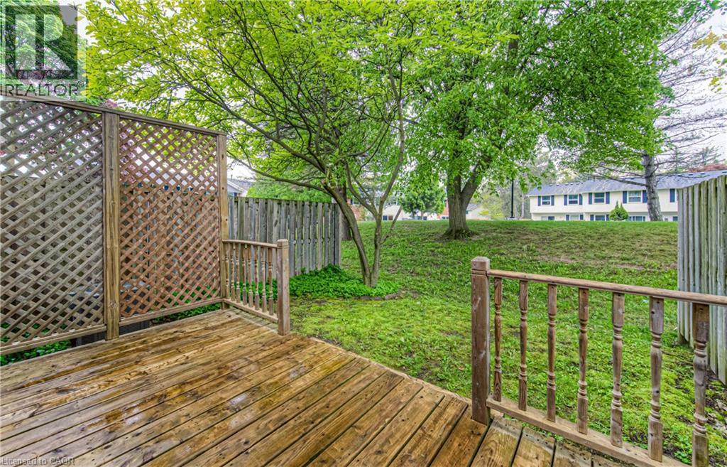 View of wooden deck - 425 Keats Way Unit# 4, Waterloo, ON - Outdoor With Deck Patio Veranda