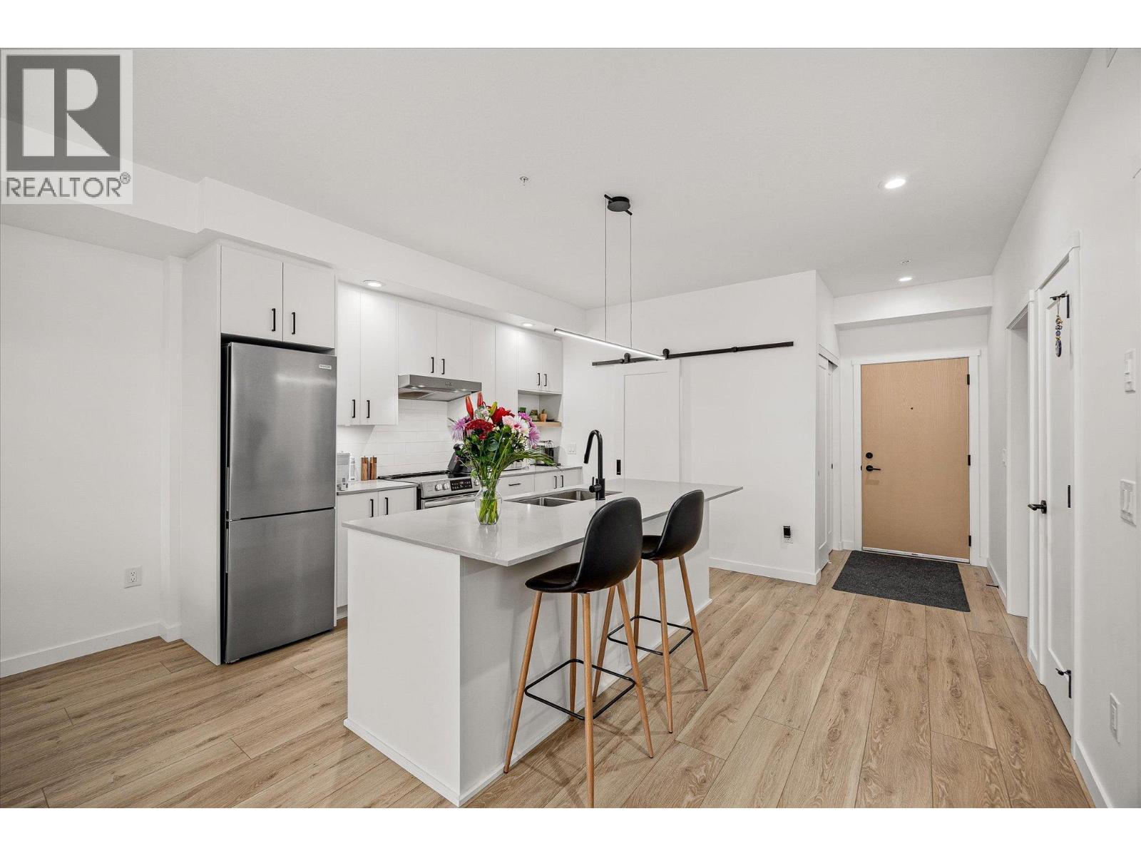 Enjoy your bright spacious kitchen - 660 Cawston Avenue Unit# 313, Kelowna, BC - Indoor Photo Showing Kitchen With Stainless Steel Kitchen