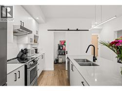 Beautiful sliding barn door gives you access to the laundry room. -