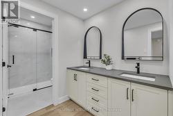 Full basement bathroom with double sink -