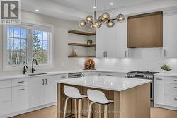 Stunning quartz counters with plenty of cabinetry! -