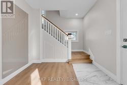 New foyer with coat area. Original Bannister! -