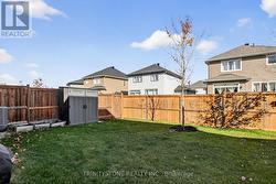 Large mainly fenced backyard -