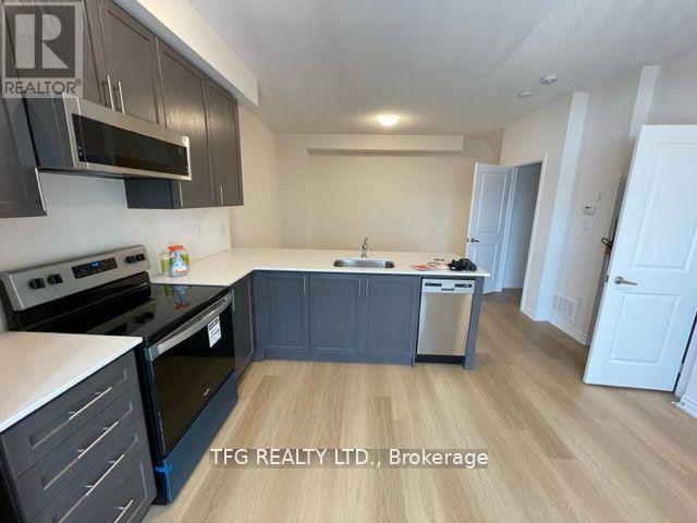 14 - 480 Beresford Path, Oshawa (Central), ON - Indoor Photo Showing Kitchen With Stainless Steel Kitchen With Upgraded Kitchen