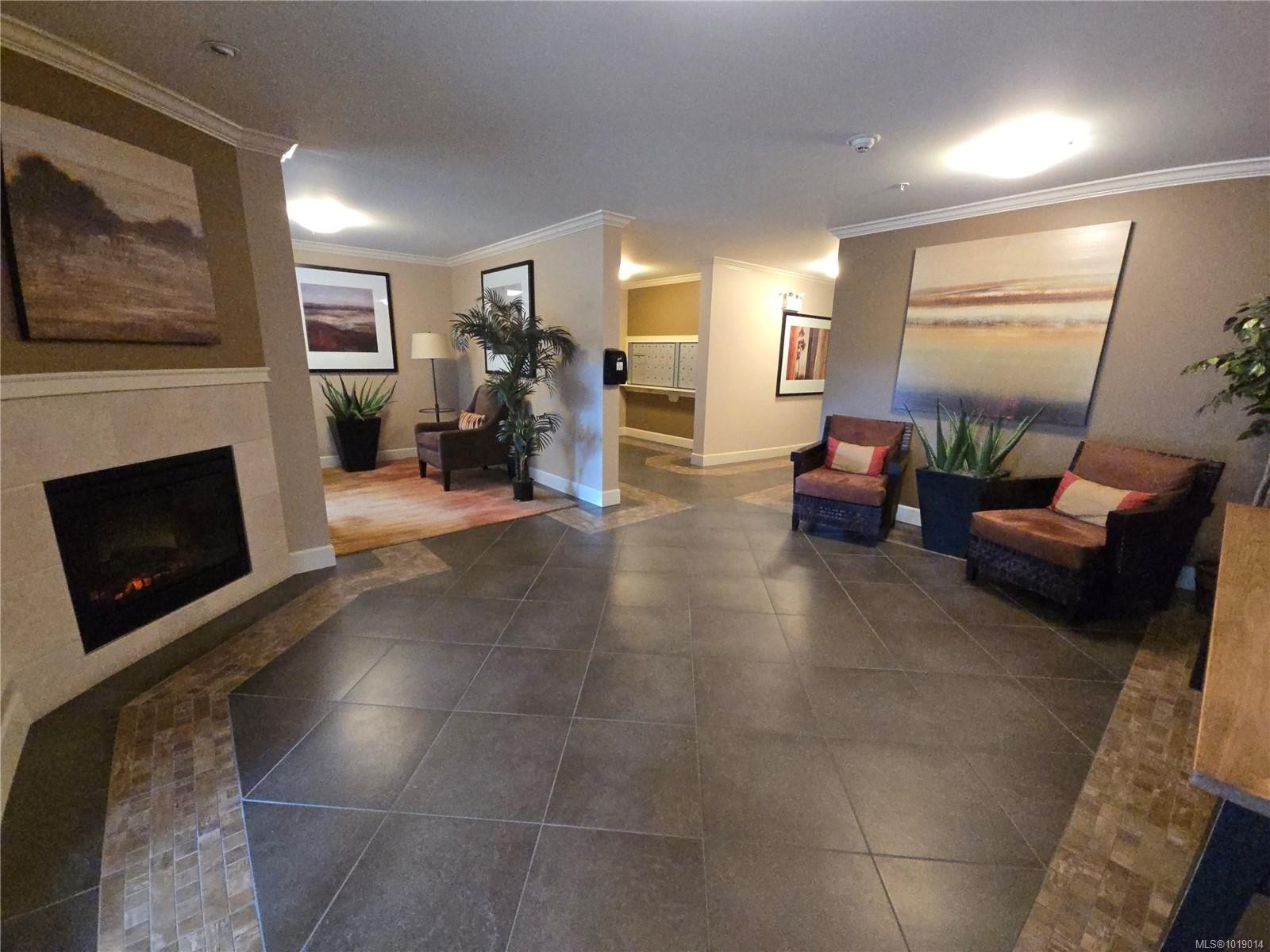 404-6728 Dickinson Rd, Nanaimo, BC - Indoor With Fireplace