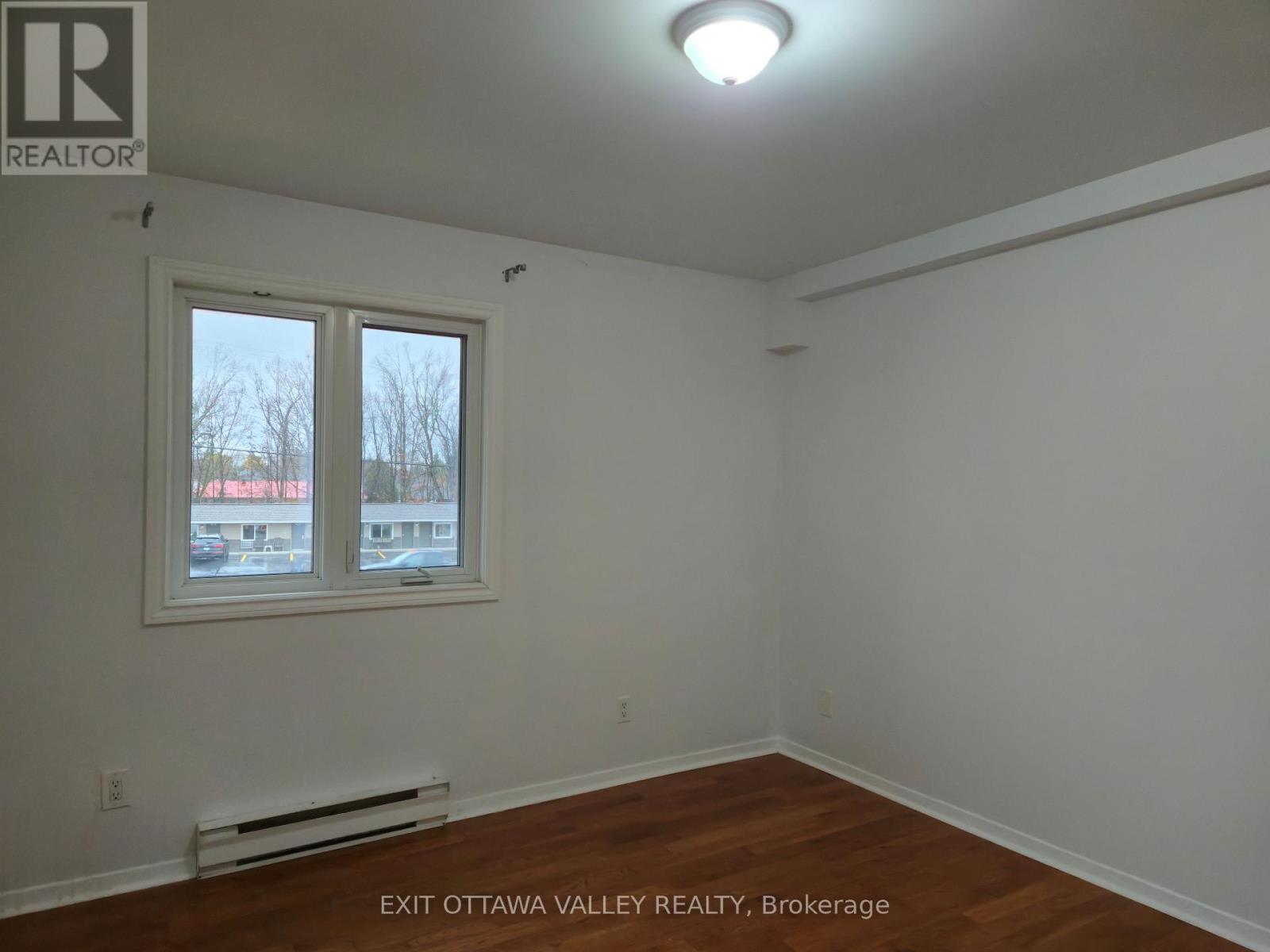 Primary bedroom not virtually staged - 3 - 10 Charles Street, Arnprior, ON - Indoor Photo Showing Other Room