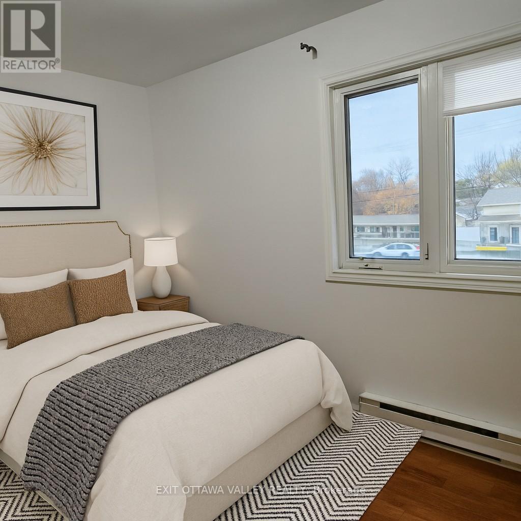 Virtually staged bedroom - 3 - 10 Charles Street, Arnprior, ON - Indoor Photo Showing Bedroom