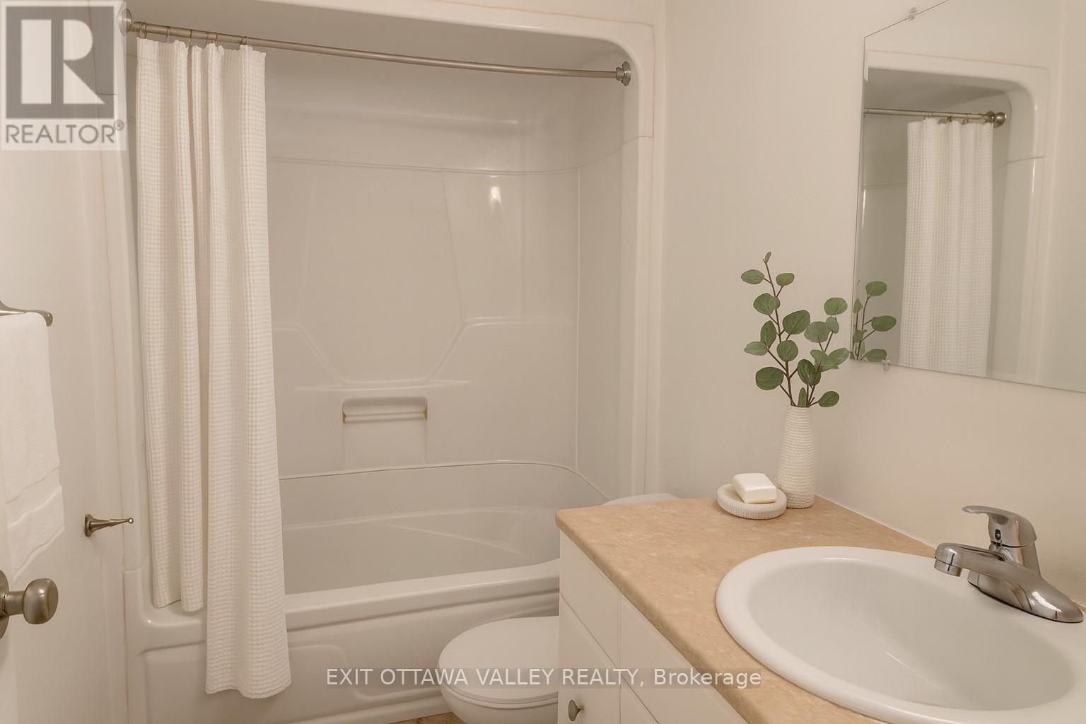Virtually staged bathroom - 3 - 10 Charles Street, Arnprior, ON - Indoor Photo Showing Bathroom