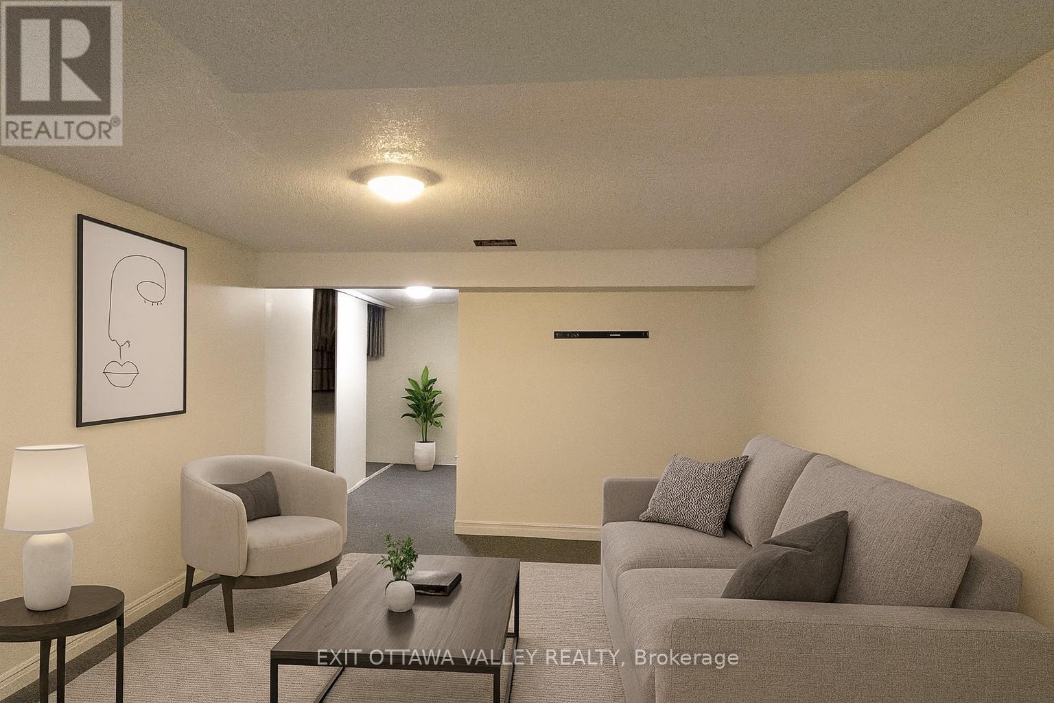 virtually staged recreation room - 3 - 10 Charles Street, Arnprior, ON - Indoor Photo Showing Living Room