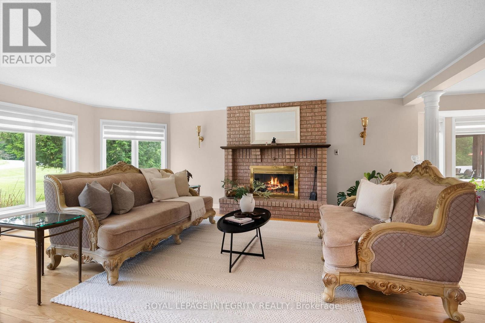22 Marchbrook Circle, Ottawa, ON - Indoor Photo Showing Living Room With Fireplace