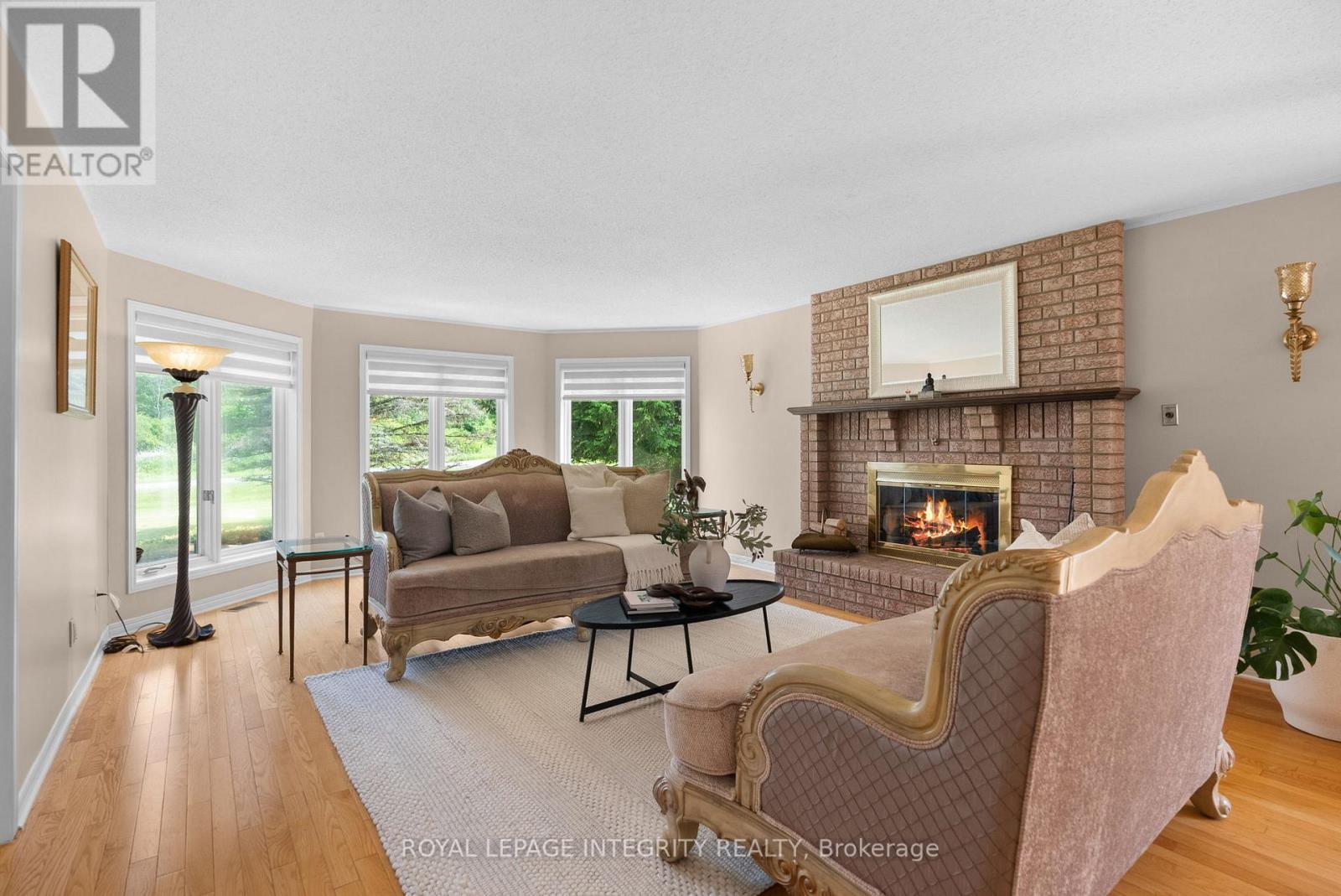 22 Marchbrook Circle, Ottawa, ON - Indoor Photo Showing Living Room With Fireplace