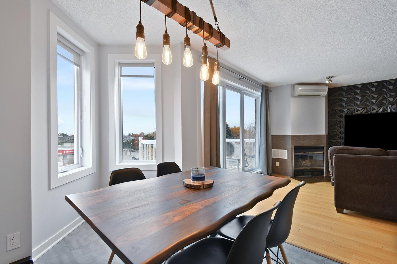 Salle à manger - 8-1191 Boul. Iberville, Repentigny (Repentigny), QC - Indoor Photo Showing Dining Room With Fireplace
