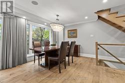 DINING AREA with elegant chandelier. -