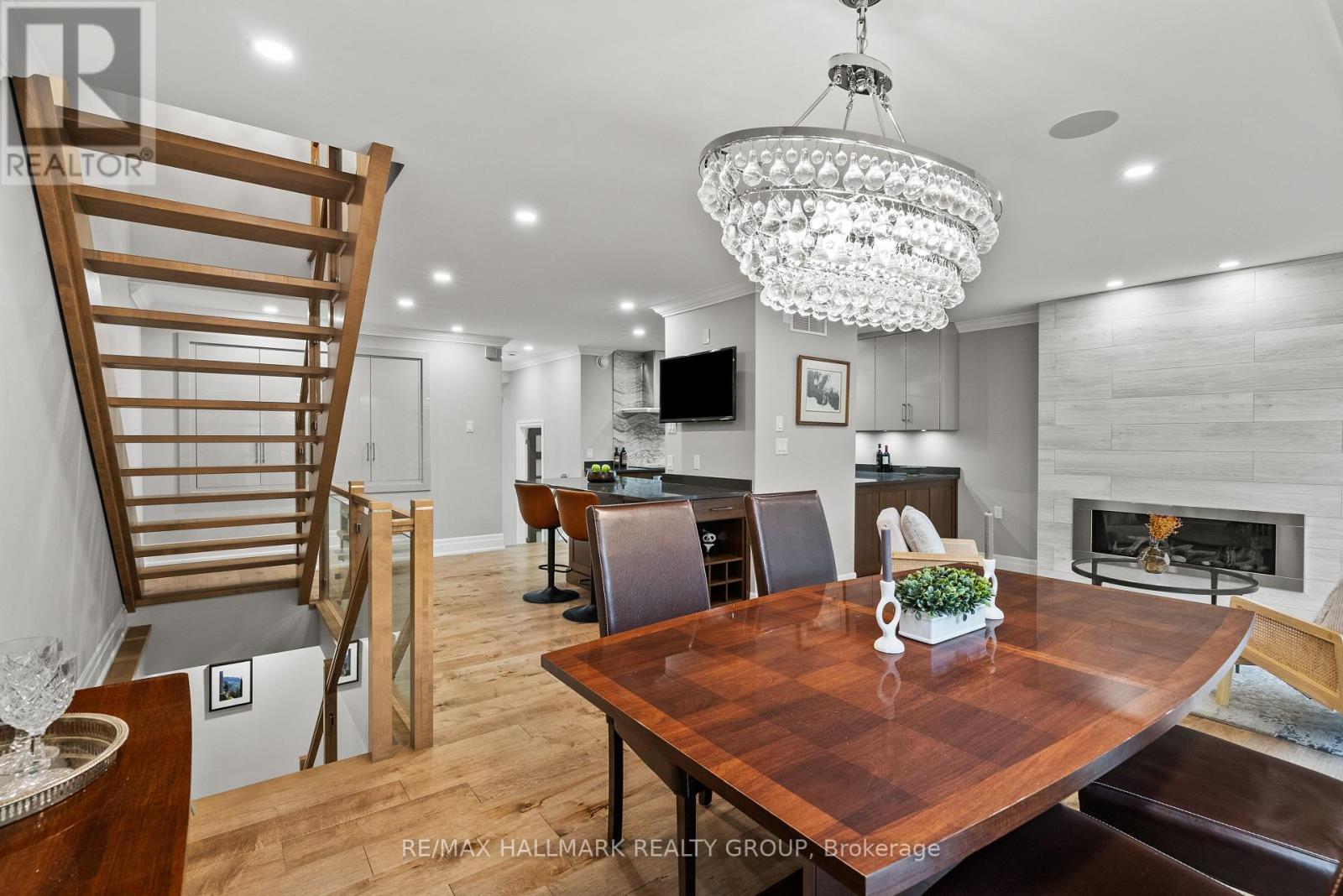 NOTE: Open risers to 2nd floor. - 217 Belford Crescent, Ottawa, ON - Indoor Photo Showing Dining Room With Fireplace