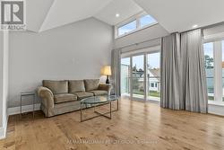 SLIDING DOORS open to BALCONY. -