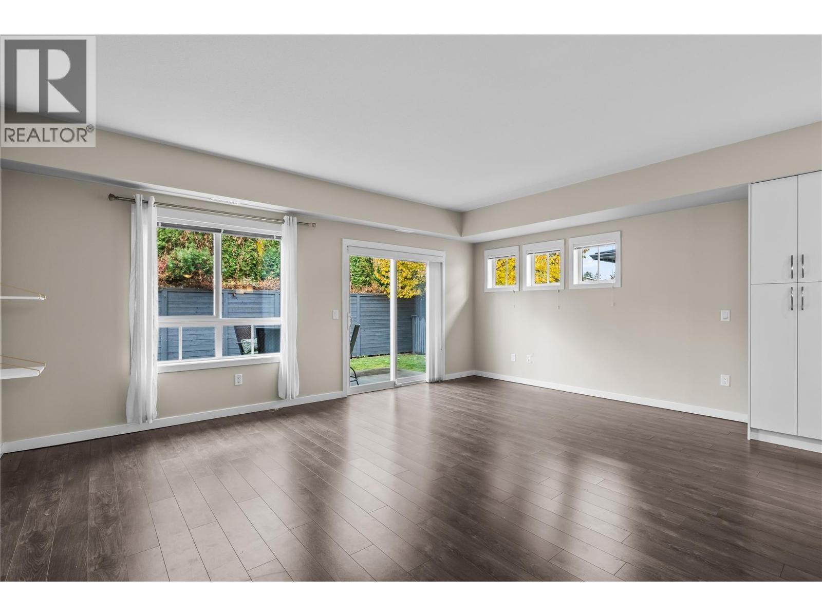 Living Room with Patio access - 680 Old Meadows Road Unit# 86, Kelowna, BC - Indoor