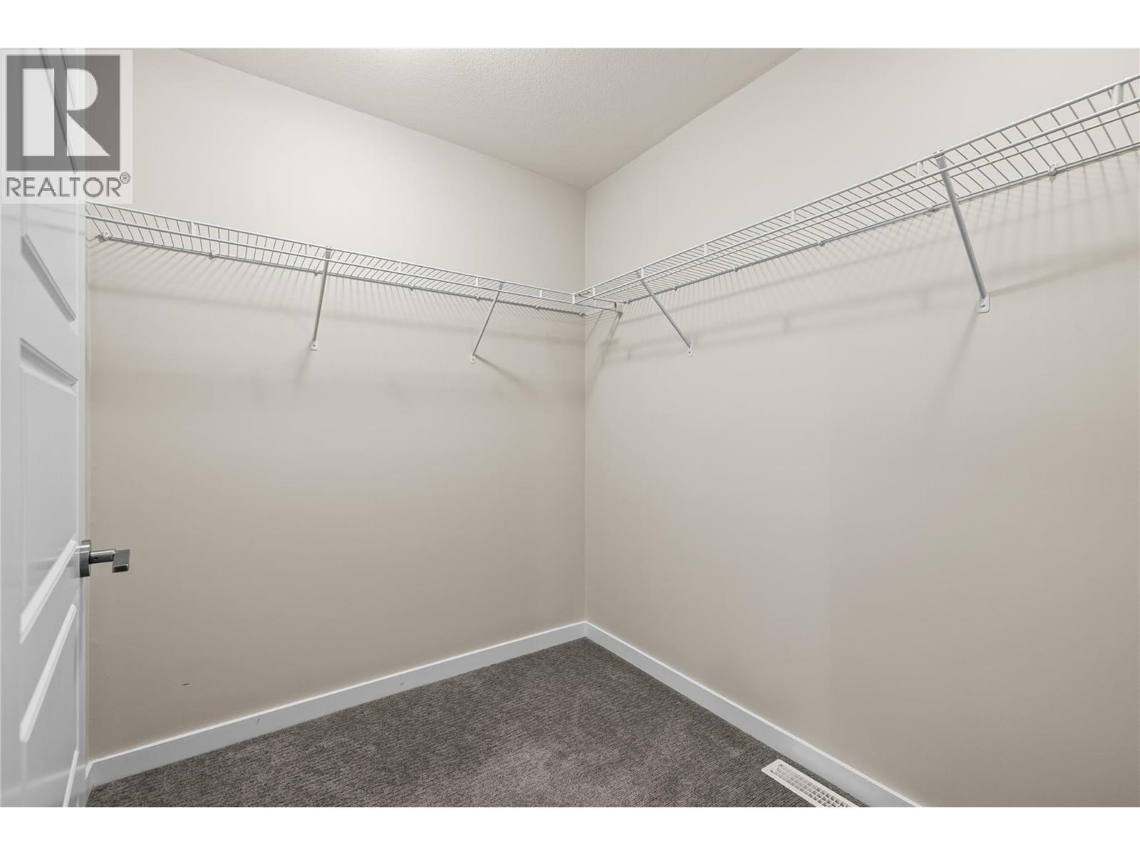 Primary walk-in closet - 680 Old Meadows Road Unit# 86, Kelowna, BC - Indoor With Storage