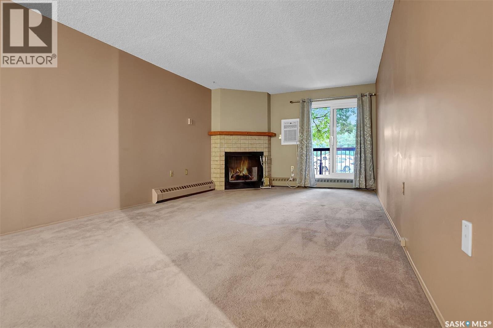 108 3420 Park Street, Regina, SK - Indoor With Fireplace