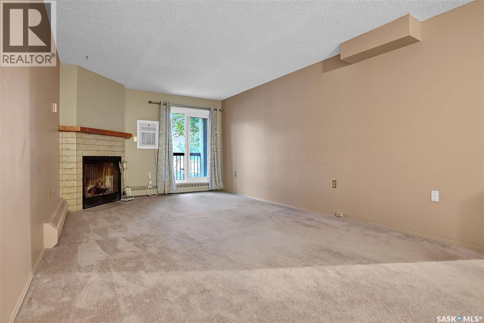 108 3420 Park Street, Regina, SK - Indoor With Fireplace