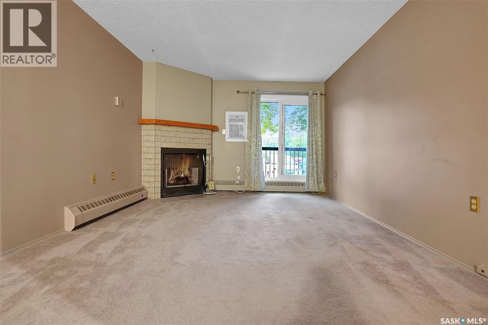 108 3420 Park Street, Regina, SK - Indoor With Fireplace