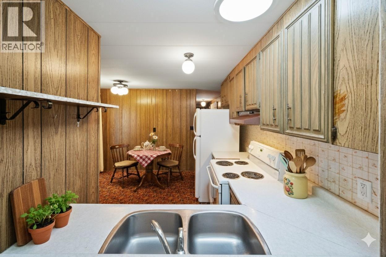 Kitchen digitally staged - 8487 Highway 97 Highway Unit# 6, Oliver, BC