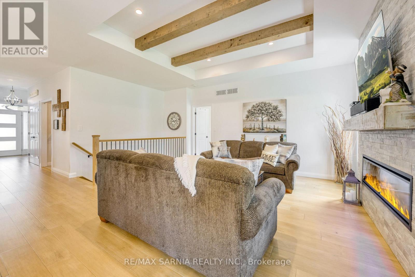 393 Bayhill Drive, St. Clair, ON - Indoor Photo Showing Living Room With Fireplace