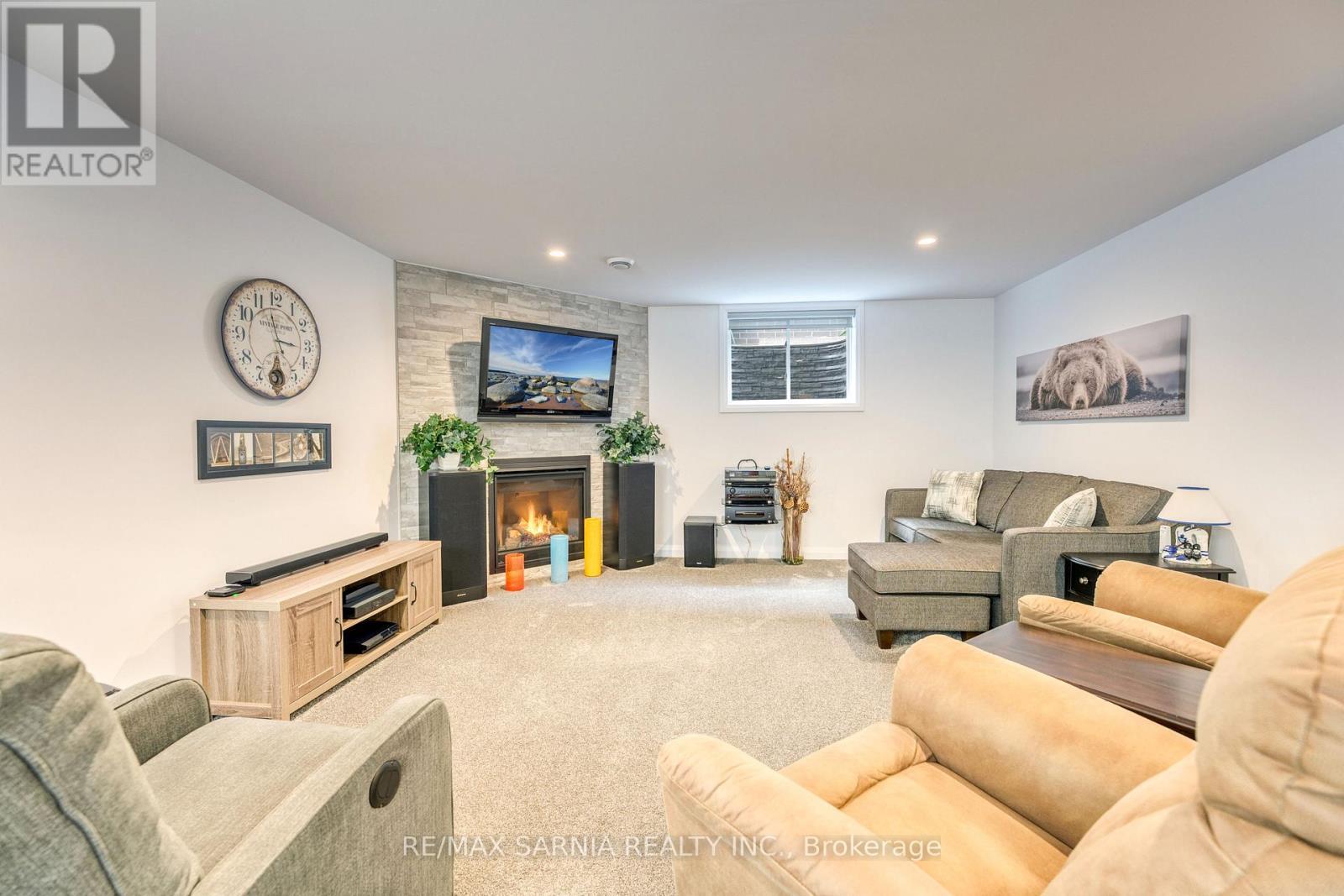 393 Bayhill Drive, St. Clair, ON - Indoor Photo Showing Other Room With Fireplace