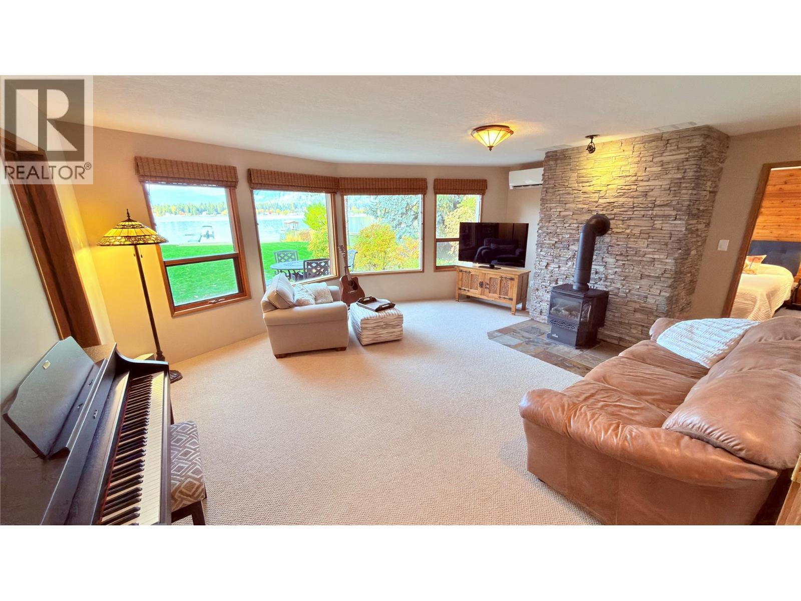 102 Sandner Road, Christina Lake, BC - Indoor Photo Showing Living Room With Fireplace