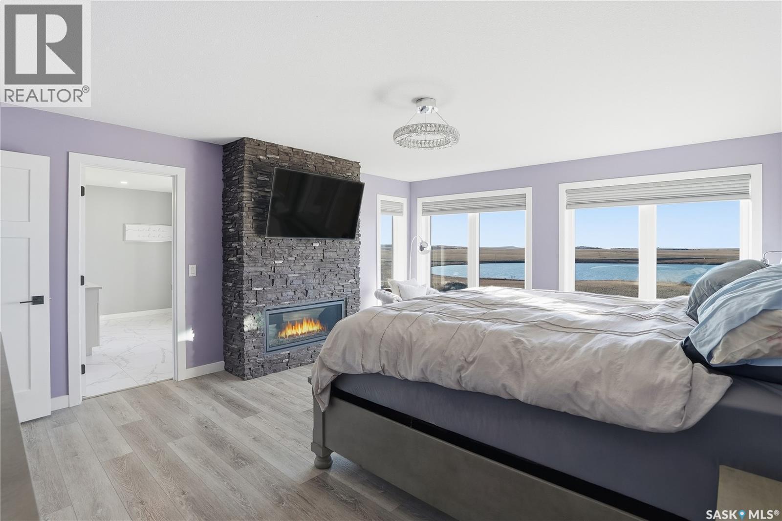 Toye Acreage, Grant Rm No. 372, SK - Indoor Photo Showing Bedroom With Fireplace