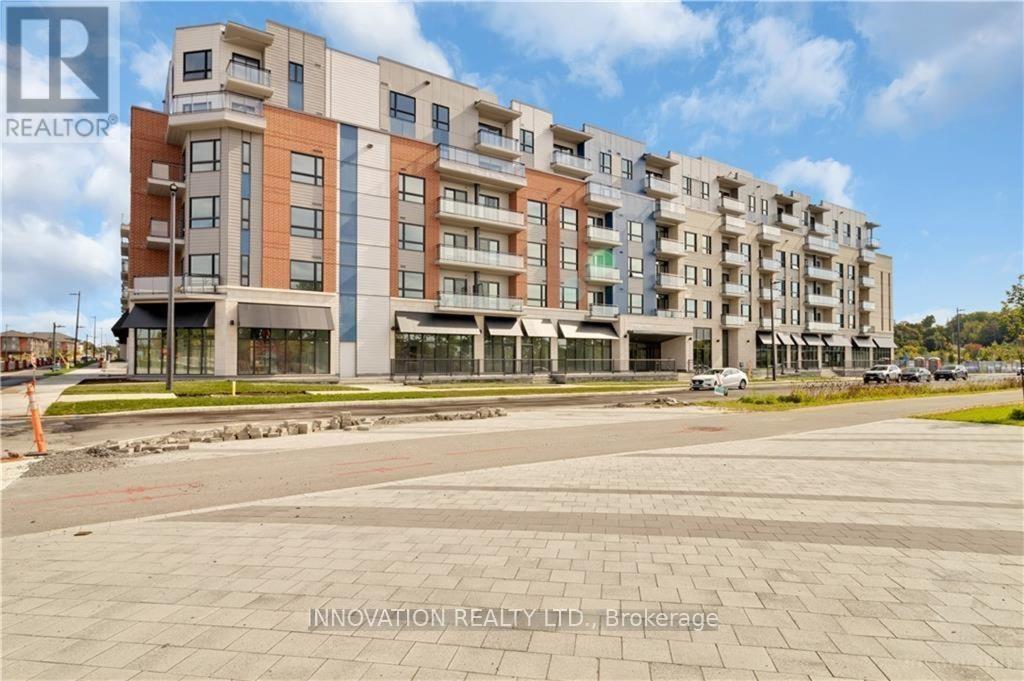 303 - 397 Codd'S Road, Ottawa, ON - Outdoor With Balcony With Facade