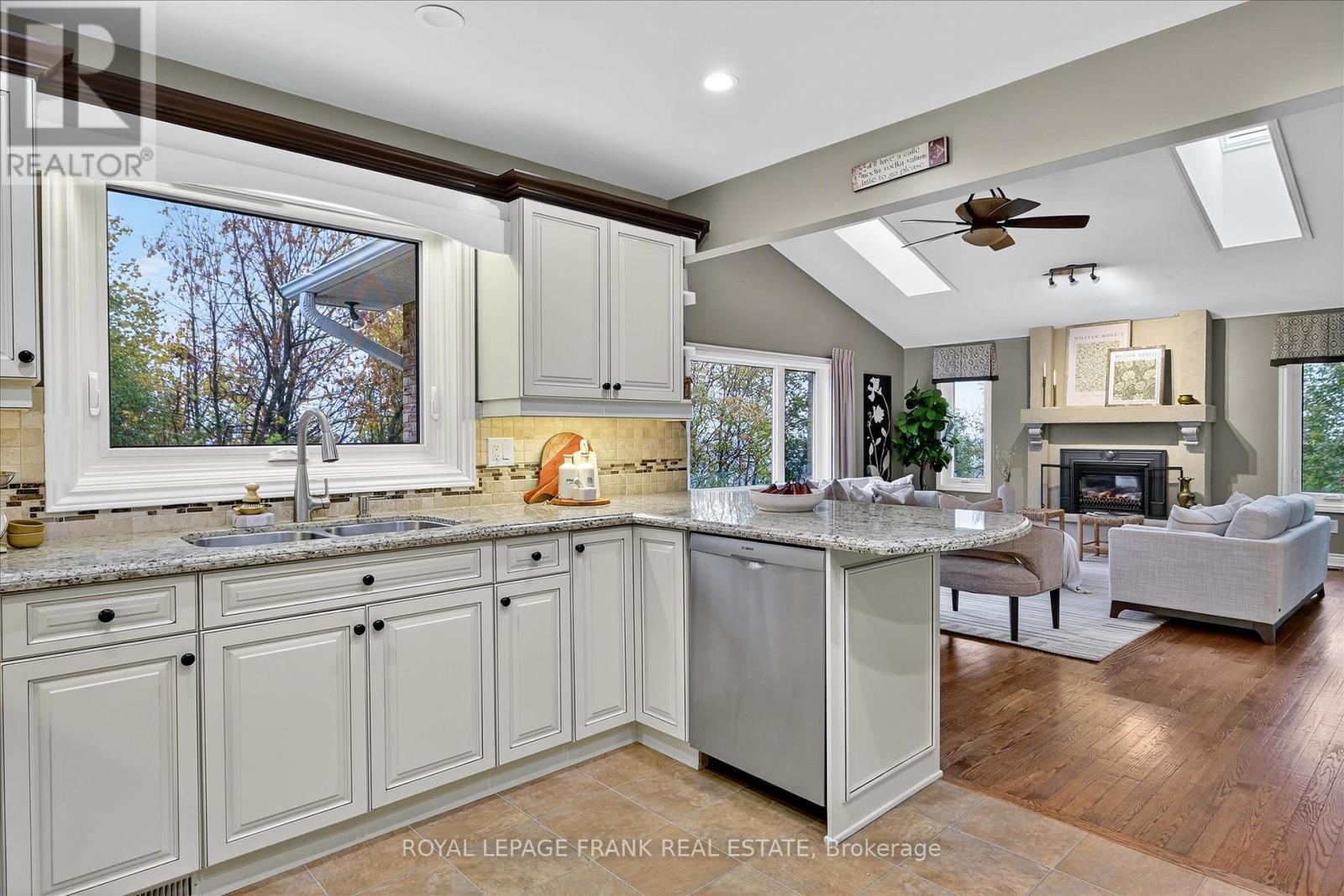 1162 Summit Drive, Peterborough (Otonabee Ward 1), ON - Indoor Photo Showing Kitchen With Fireplace With Double Sink