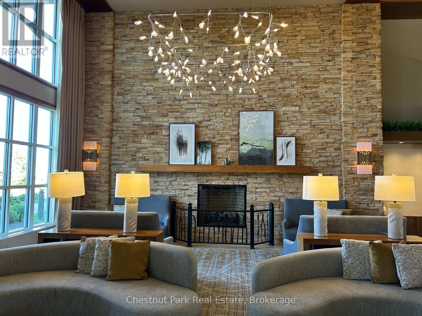 165 - 220 Gord Canning Drive, Blue Mountains, ON - Indoor Photo Showing Living Room With Fireplace