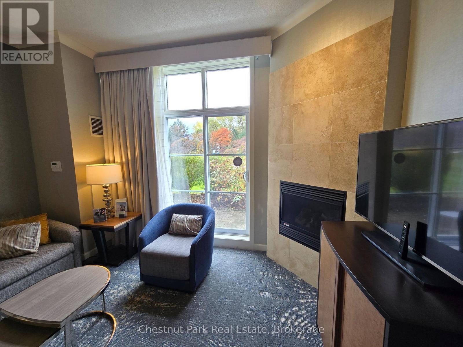 165 - 220 Gord Canning Drive, Blue Mountains, ON - Indoor Photo Showing Living Room With Fireplace