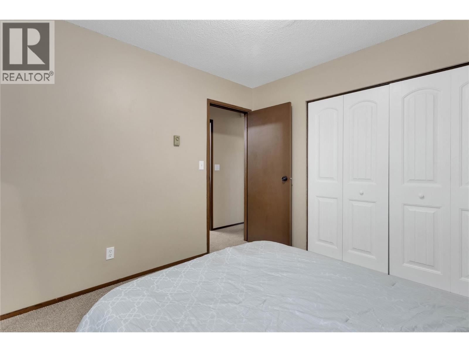 Second Bedroom - 588 Mccurdy Road, Kelowna, BC - Indoor Photo Showing Bedroom