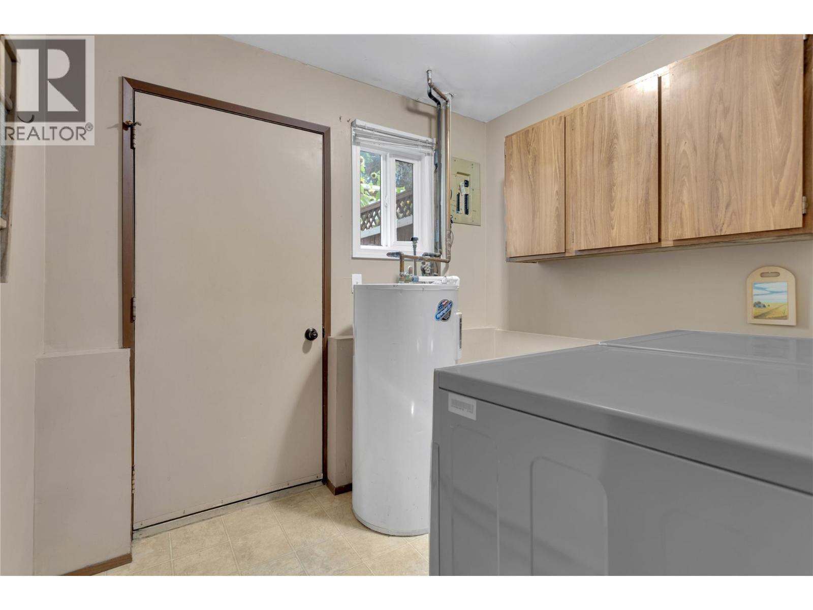 Laundry, Mechanical and Direct Access to Private and Fenced Backyard. - 588 Mccurdy Road, Kelowna, BC - Indoor