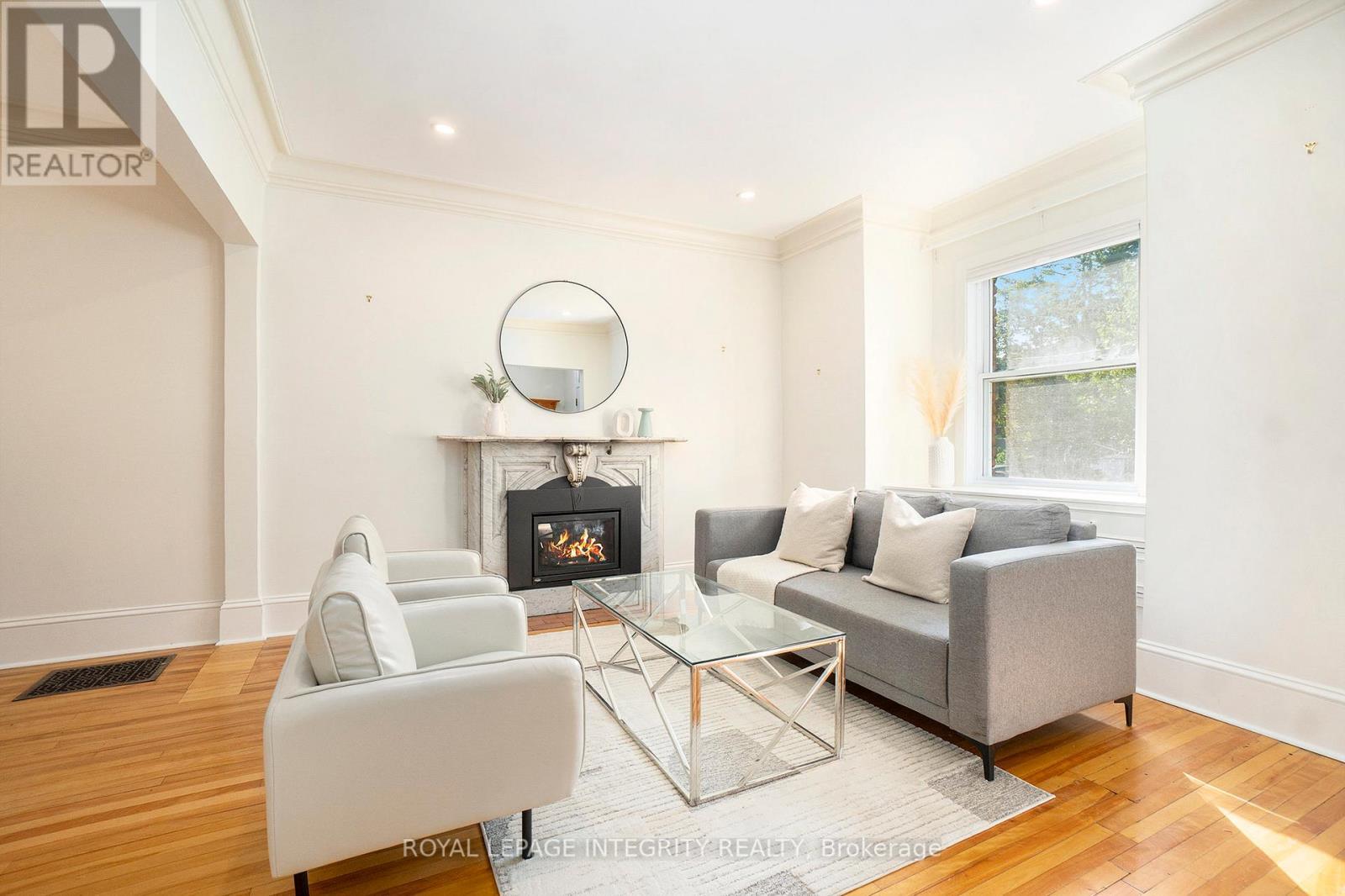 Gorgeous stone fireplace - 115 Springhurst Avenue, Ottawa, ON - Indoor Photo Showing Living Room With Fireplace