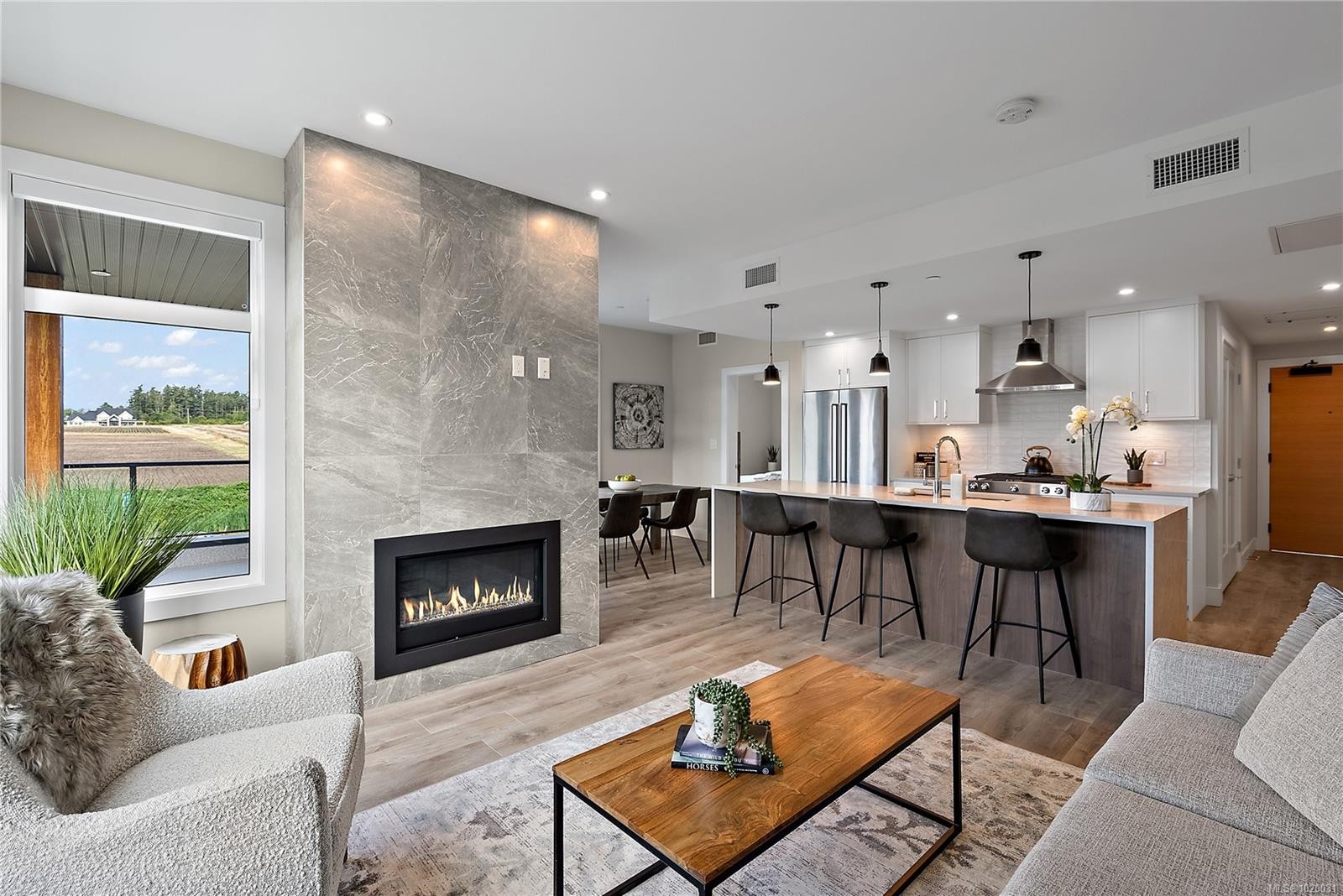 201-2520 Hackett Cres, Central Saanich, BC - Indoor Photo Showing Living Room With Fireplace