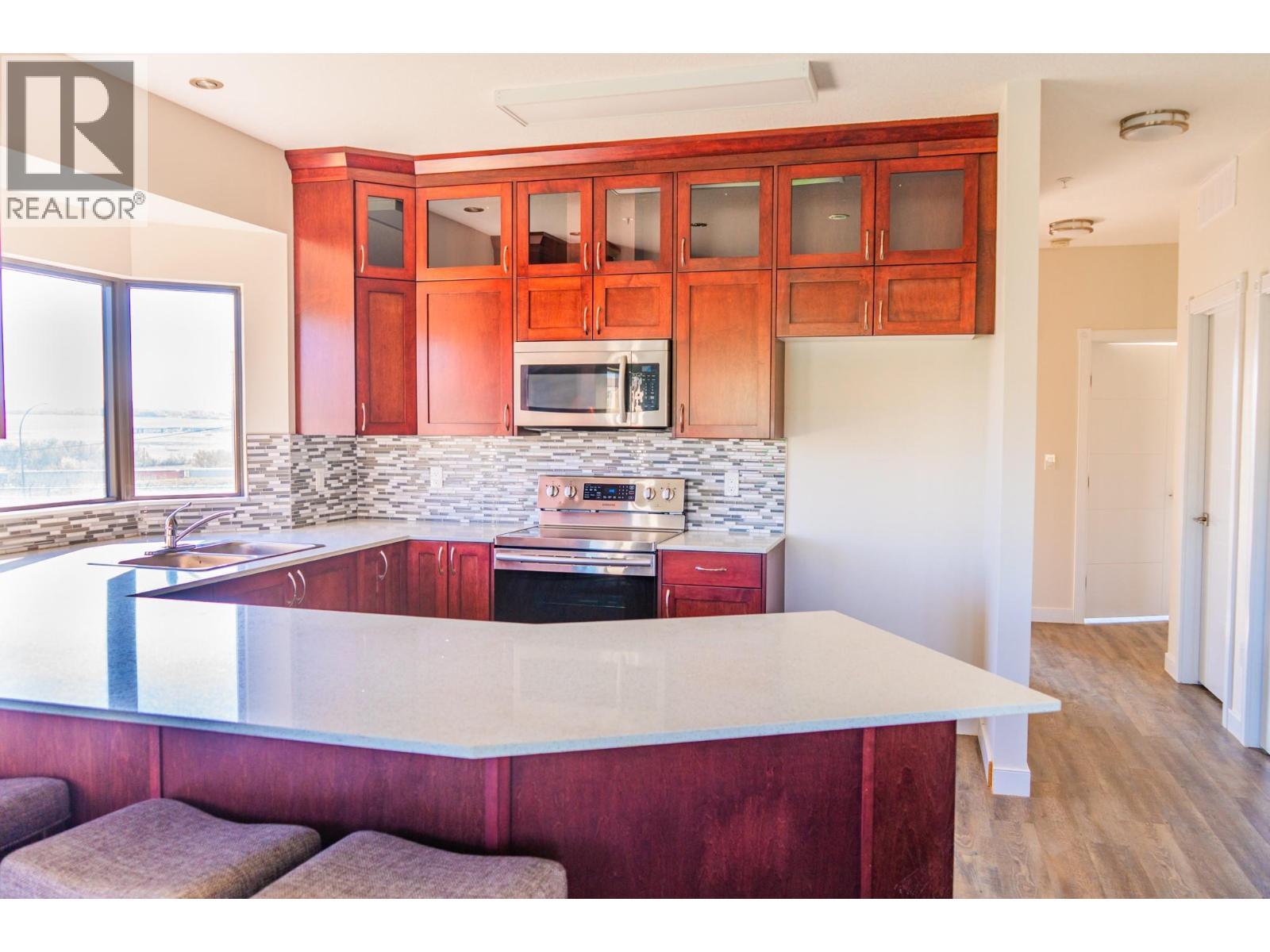 2032 86 Avenue Unit# 1202, Dawson Creek, BC - Indoor Photo Showing Kitchen With Upgraded Kitchen