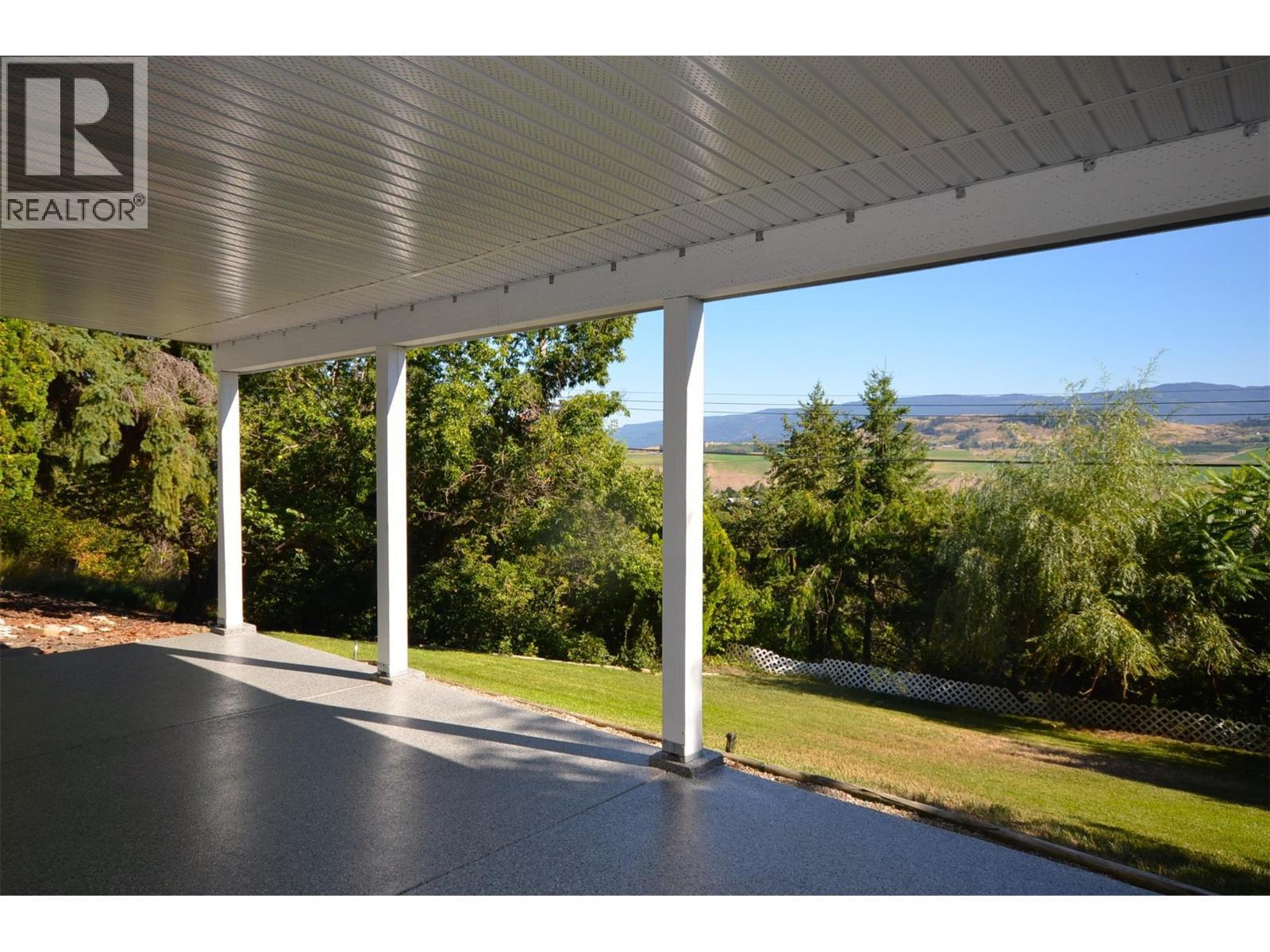 High quality cement patio - 6609 Southwind Road, Vernon, BC - Outdoor With Deck Patio Veranda With View