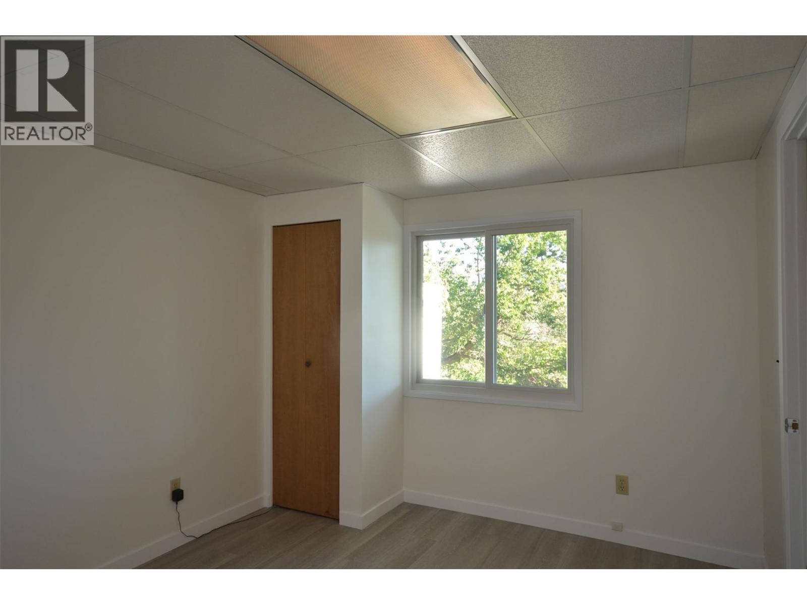 Fourth Bedroom overlooks backyard - 6609 Southwind Road, Vernon, BC - Indoor Photo Showing Other Room
