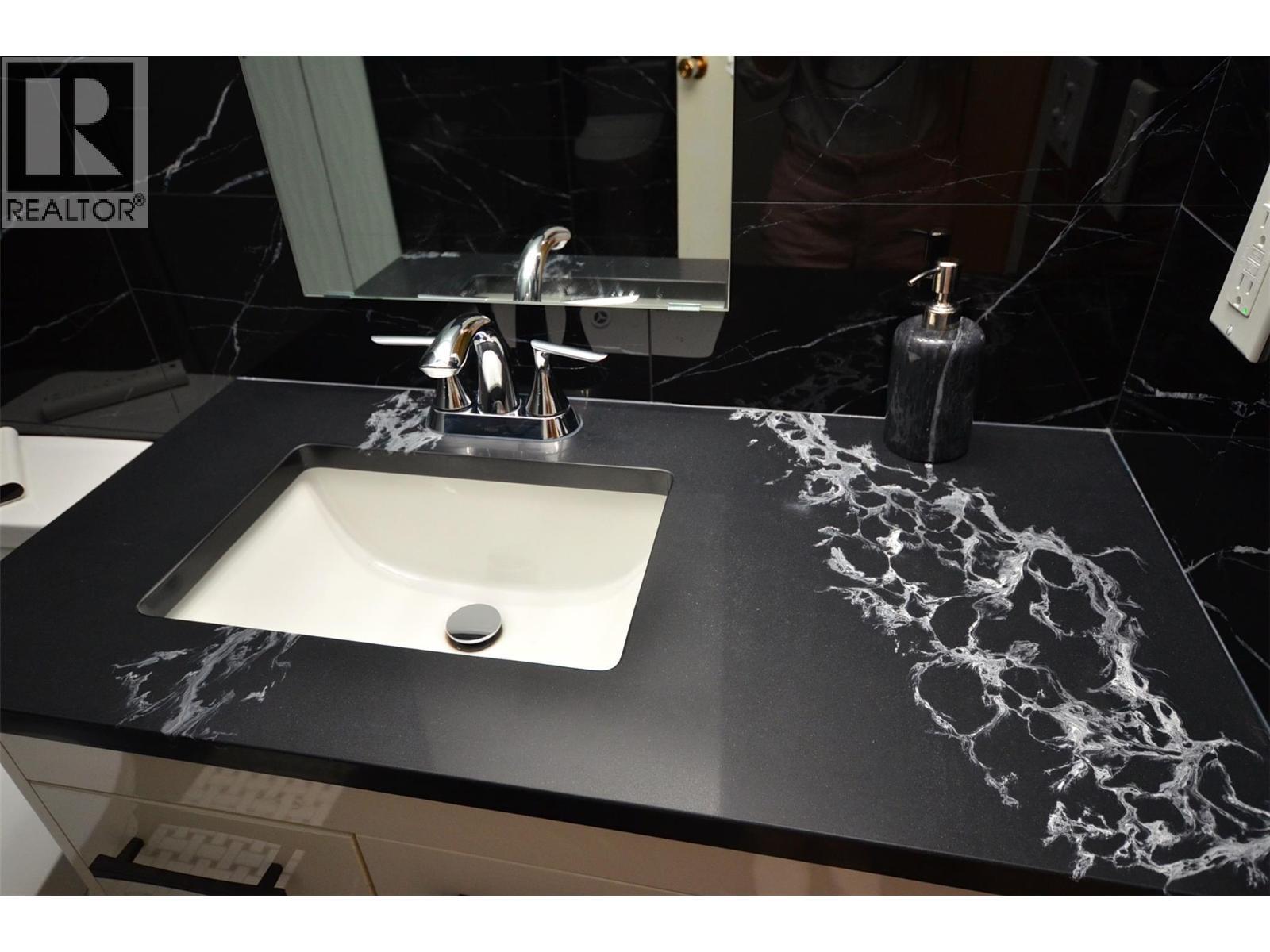 gorgeous sink, vanity, taps - 6609 Southwind Road, Vernon, BC - Indoor Photo Showing Bathroom