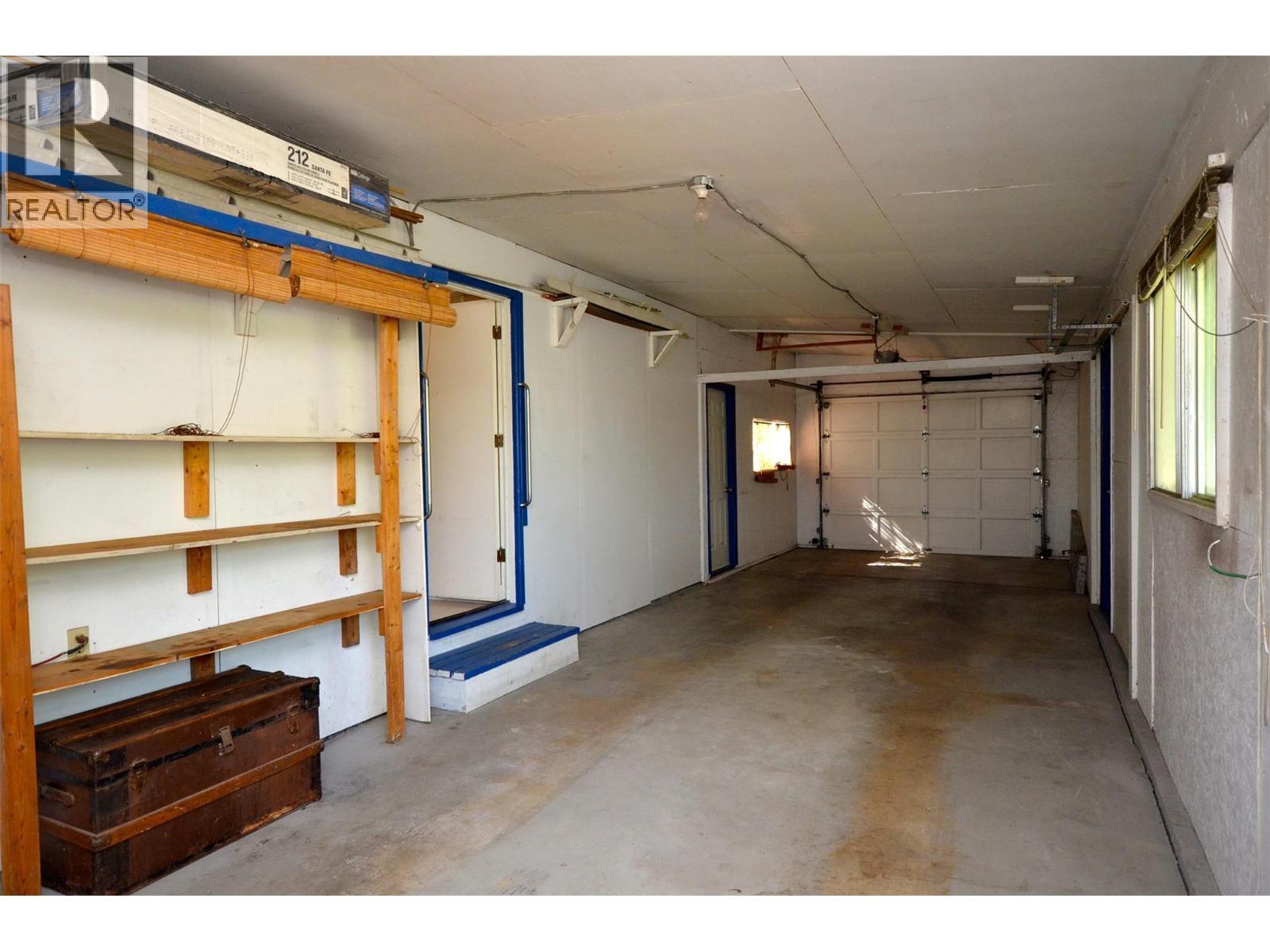 Double long single car garage - 6609 Southwind Road, Vernon, BC - Indoor Photo Showing Garage