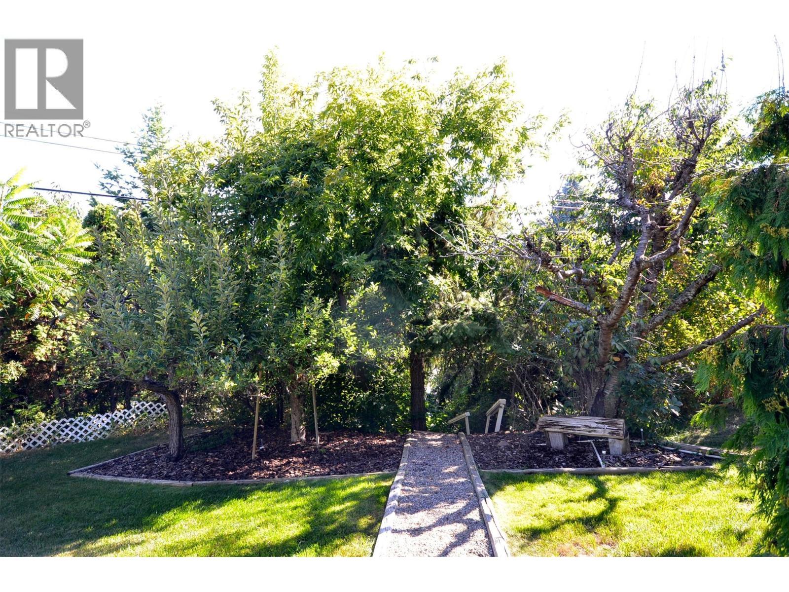 Log bench under the trees - 6609 Southwind Road, Vernon, BC - Outdoor