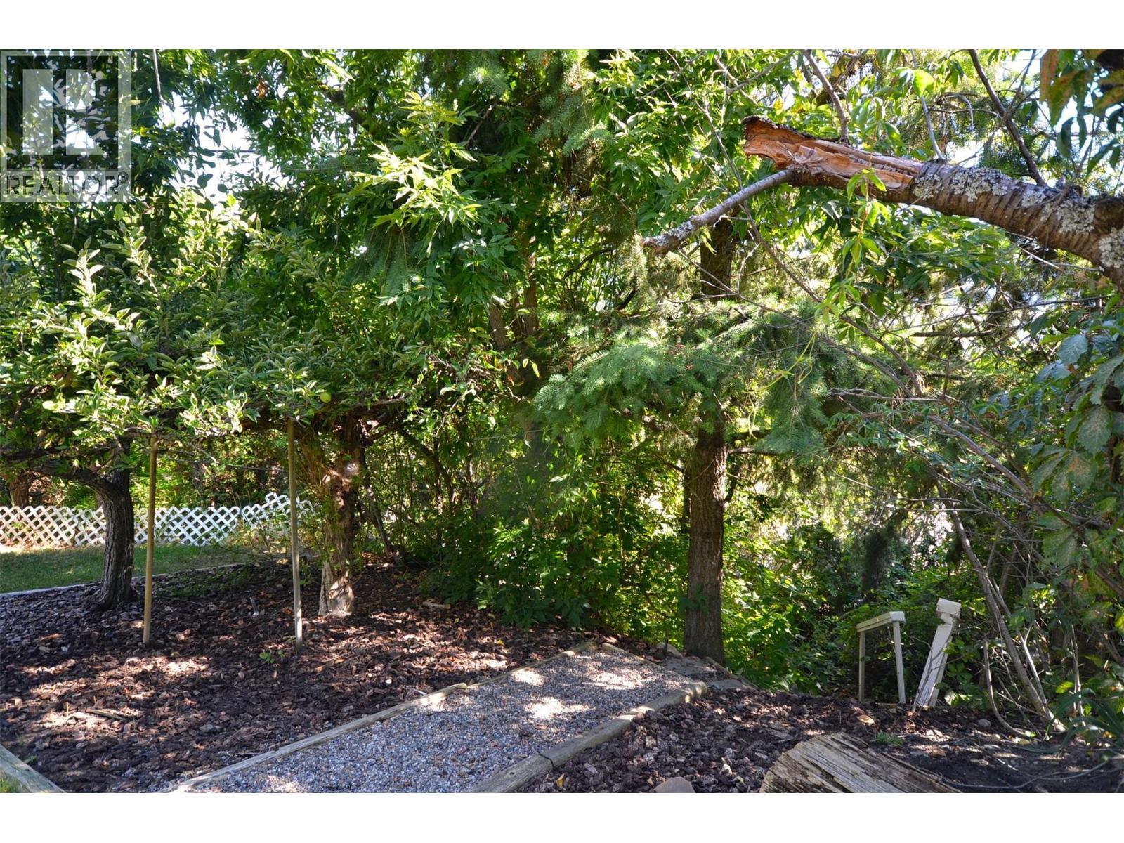 Path through the trees to the road below - 6609 Southwind Road, Vernon, BC - Outdoor