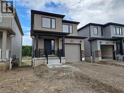 View of front of house featuring driveway and an attached garage -