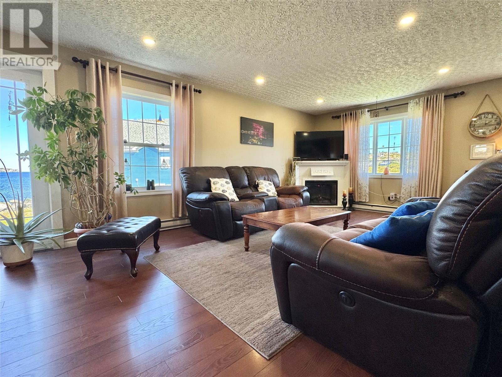 40 Main Street, Twillingate, NL - Indoor Photo Showing Living Room With Fireplace
